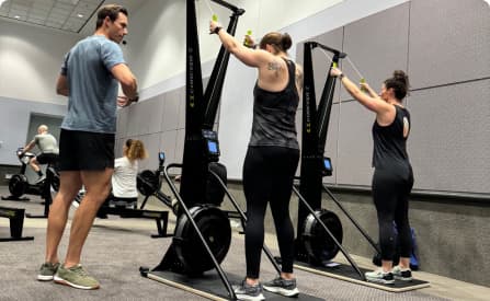 A trainer giving advice on how to use the SkiErg